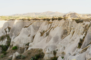 Picturesque summer view Scenic on landscape view of geologic formations of Cappadocia. Amazing shaped sandstone rocks. Famous touristic place and romantic travel destination..