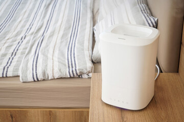 Modern humidifier in the bedroom by the bed