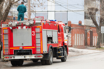 a fire truck is standing on the street