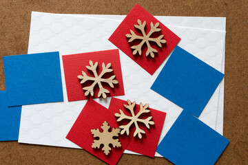 Obraz premium paper squares with wooden snowflakes