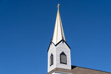 Fototapeta na wymiar Steeple of the Phoenix Church in Michigan on a sunny day