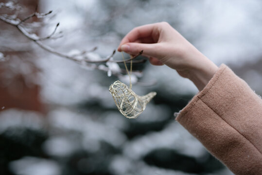 A woman in her twenties standing in the snow