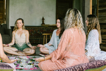 Group of Women Meditating Around Flower Mandala