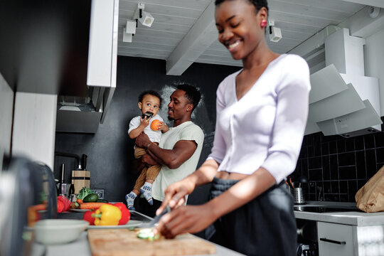 Child spending time with parents at home 