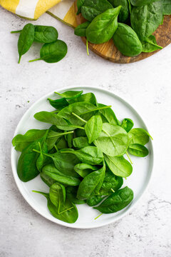 Spinach leaves on a white dish