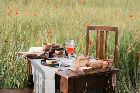 Still Life Of Italian Rustic Breakfast In A Poppy Field