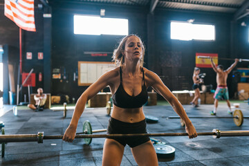 A fit athlete lifting a barbell
