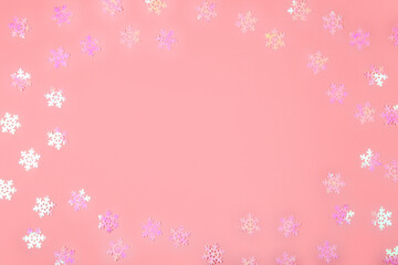 Abstract Christmas background in pink. Pink confetti on a pink background, copy space for text