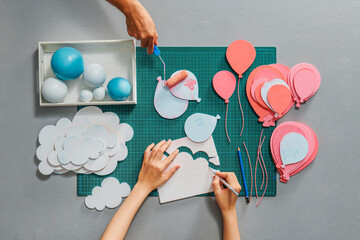 Top view of designer working place with art project template