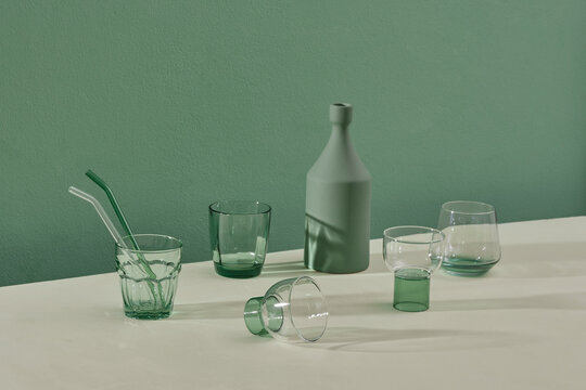 Vintage decor, with drink glass and vase on green