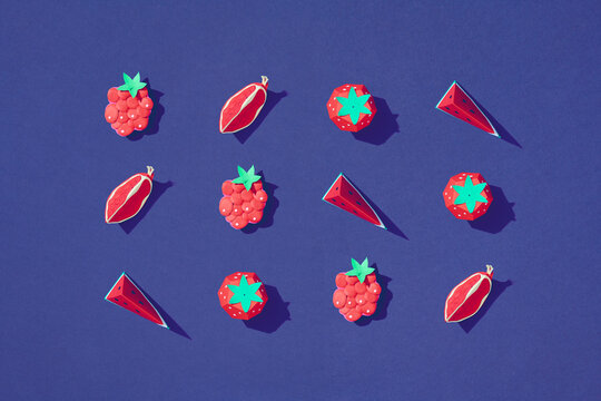 exotic fruit made of paper on blue background.