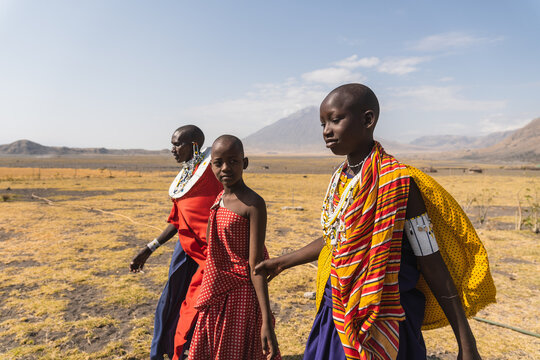 Maasai woman walking in Africa desert