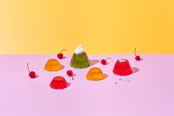 Colorful gelatin desserts and cherries