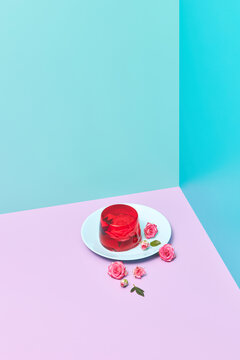 Jelly dessert with rose flowers on the plate