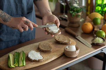 Woman Spreading Ricotta On Wholemeal Bruschetta 