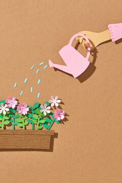 Watering flowers in the garden of a country house.