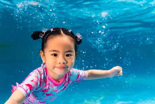 swimming kid underwater