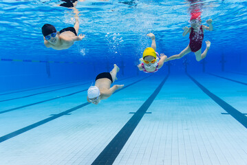 fours kids swimming 