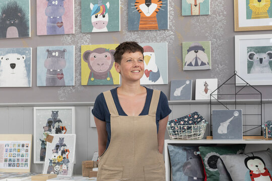 Portrait Of Young Woman In Overalls Smiling