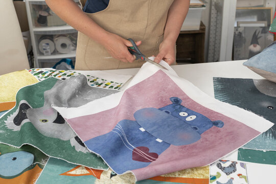 Young Artist Cutting Printed Colorful Illustration