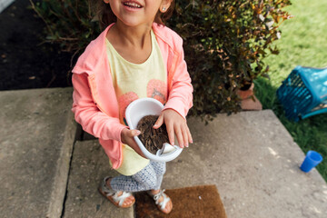 Baby rabbit captured in container. 