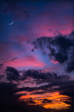 Beautiful sunset with crescent moon