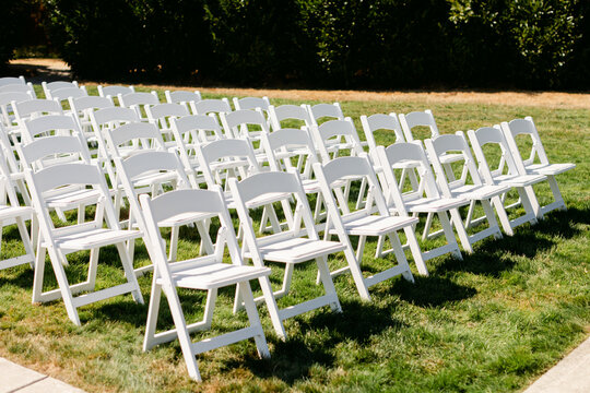 Empty White Chairs at Wedding Ceremony Site