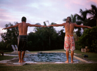 two young men at pools side