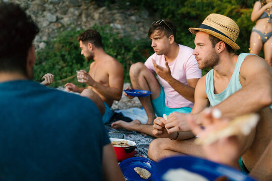 Friends having a picnic on a beach 