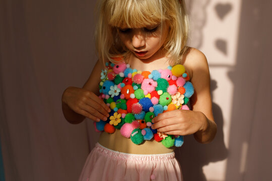 A girl in pom pom costume