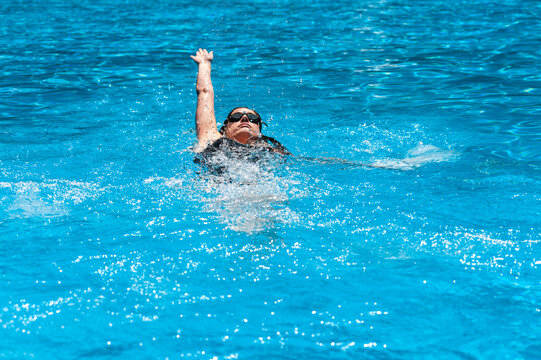 Sportswoman swimming at pool