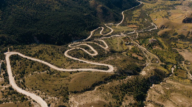 drone view of a windy road in the mountains