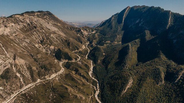 curvy road through the mountains, drone landscape