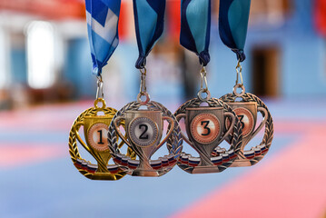 medals, gold, silver, and bronze on a blurred background