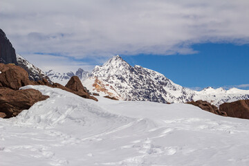 Fototapeta na wymiar Winter season. Snowed mountains in La Egorda Valley, Cajón del Maipo, central Andes mountain range, Chile