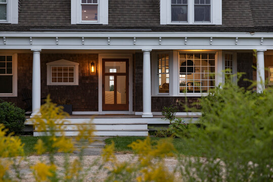 Contemporary Craftsman home at twilight with driveway