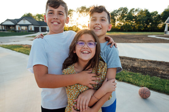 Kids embracing each other with a hug. 