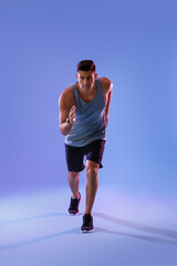 Fototapeta na wymiar Sporty male runner on color background