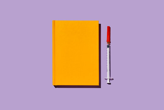 syringe and notebook