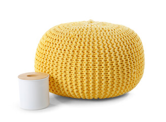 Yellow knitted pouf and tissue box on white background
