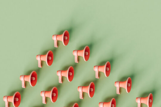 cordless megaphones on a pastel green background