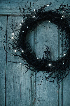 Black wreath with small skeleton on door