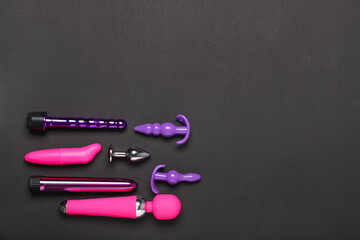 Different sex toys on dark background