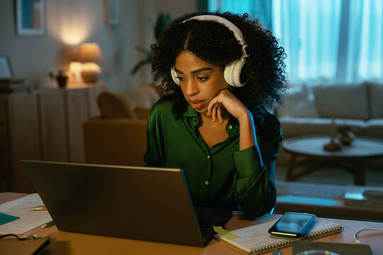 Black freelancer working at night