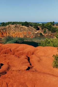 Landscape of disused bauxite quarry with little lake