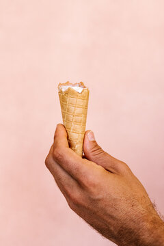Crop person eating ice cream