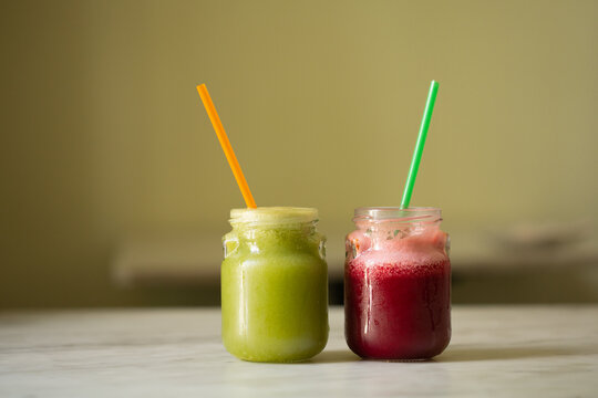Healthy smoothies with raspberry, mint, ananas, orange and lime