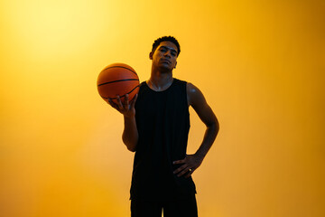 Determined black basketball player with ball