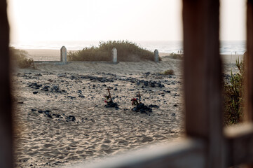 Graves on sandy cemetery
