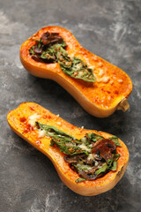 Tasty stuffed pumpkins on black background